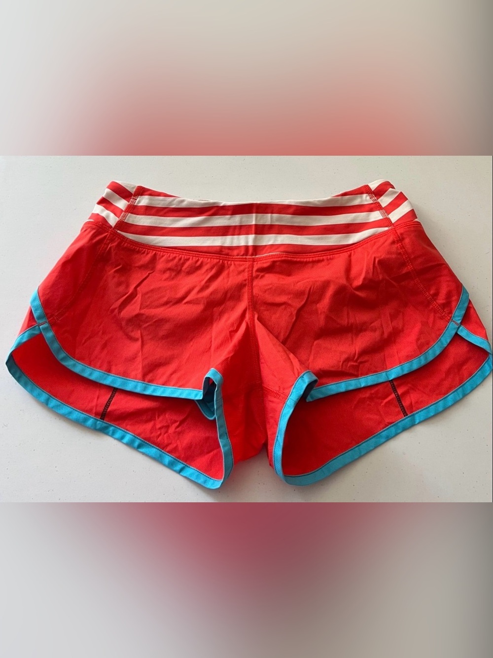 lululemon athletica orange Shorts with White Stripe Waistband and Blue Trim